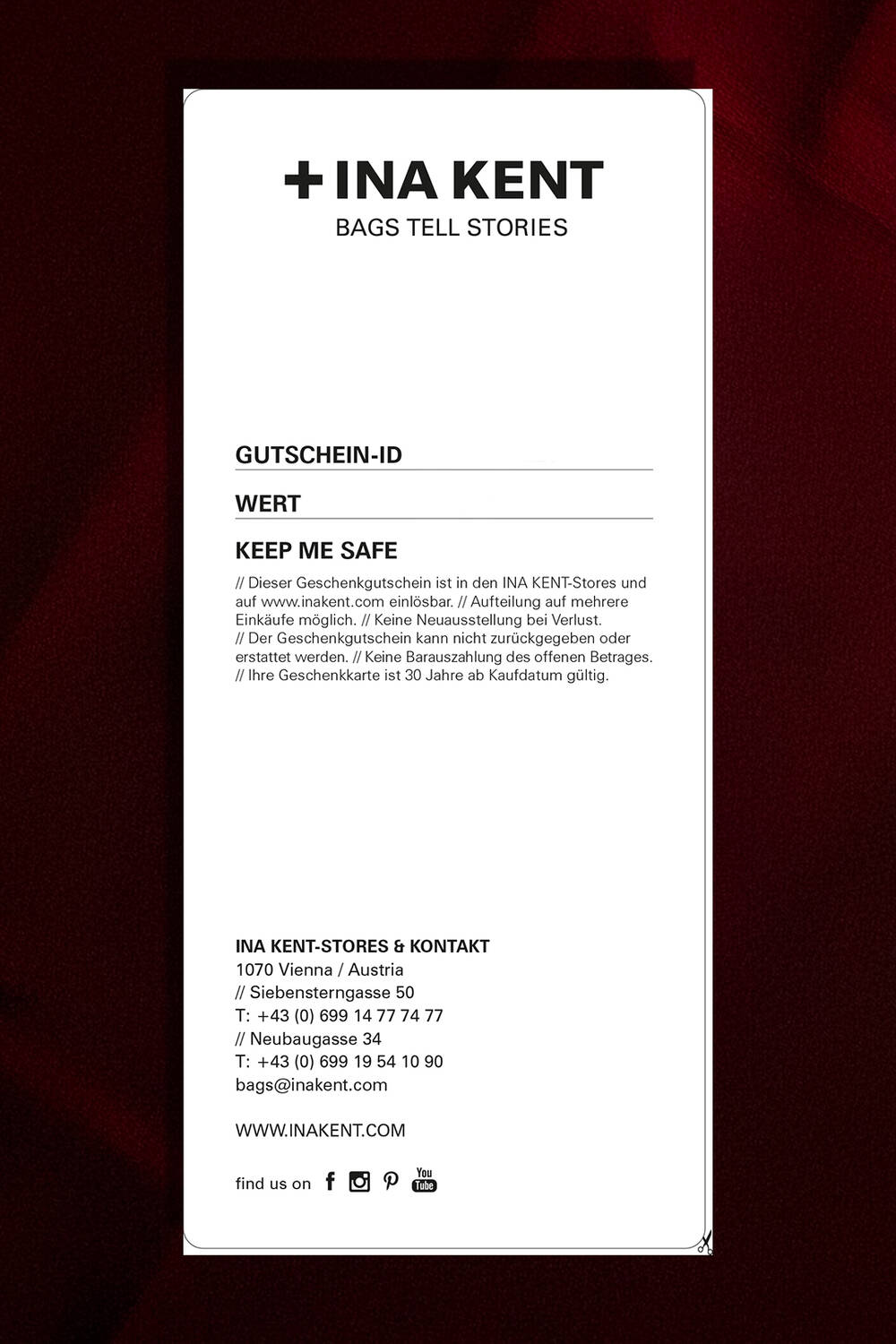 Eine rechteckige INA KENT-Geschenkkarte enthält Informationen in deutscher Sprache über die Gutscheinbedingungen, Kontaktdaten und den Standort des Geschäfts, alles vor einem sauberen weißen Hintergrund.