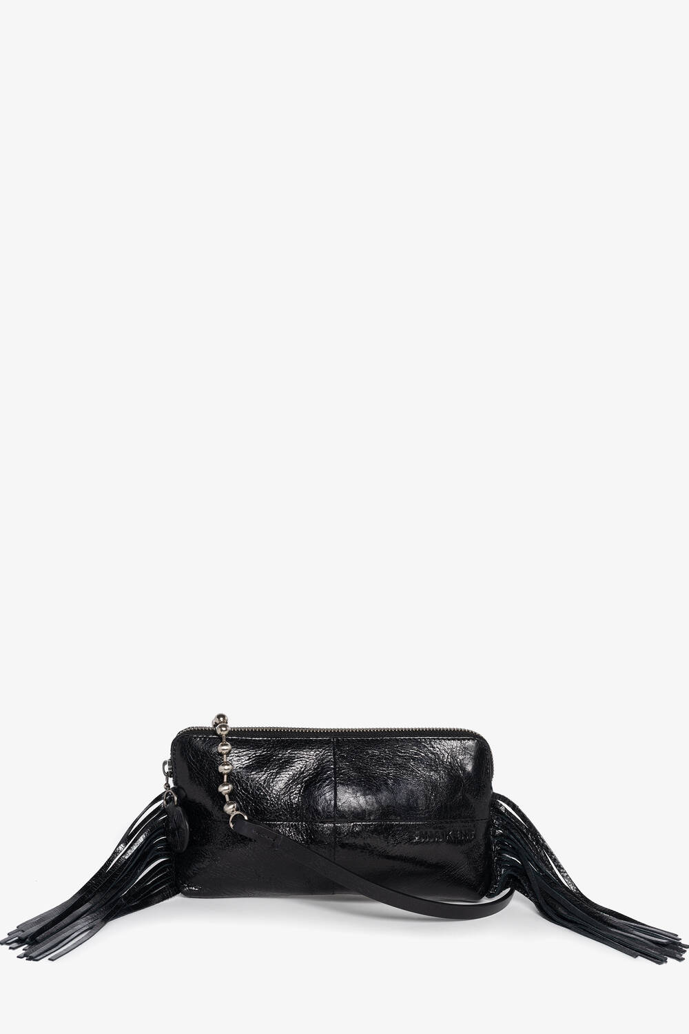 Black leather INA KENT crossbody bag with a zip closure, silver-tone stud detailing, and long fringe accents on both sides, displayed against a plain white background.