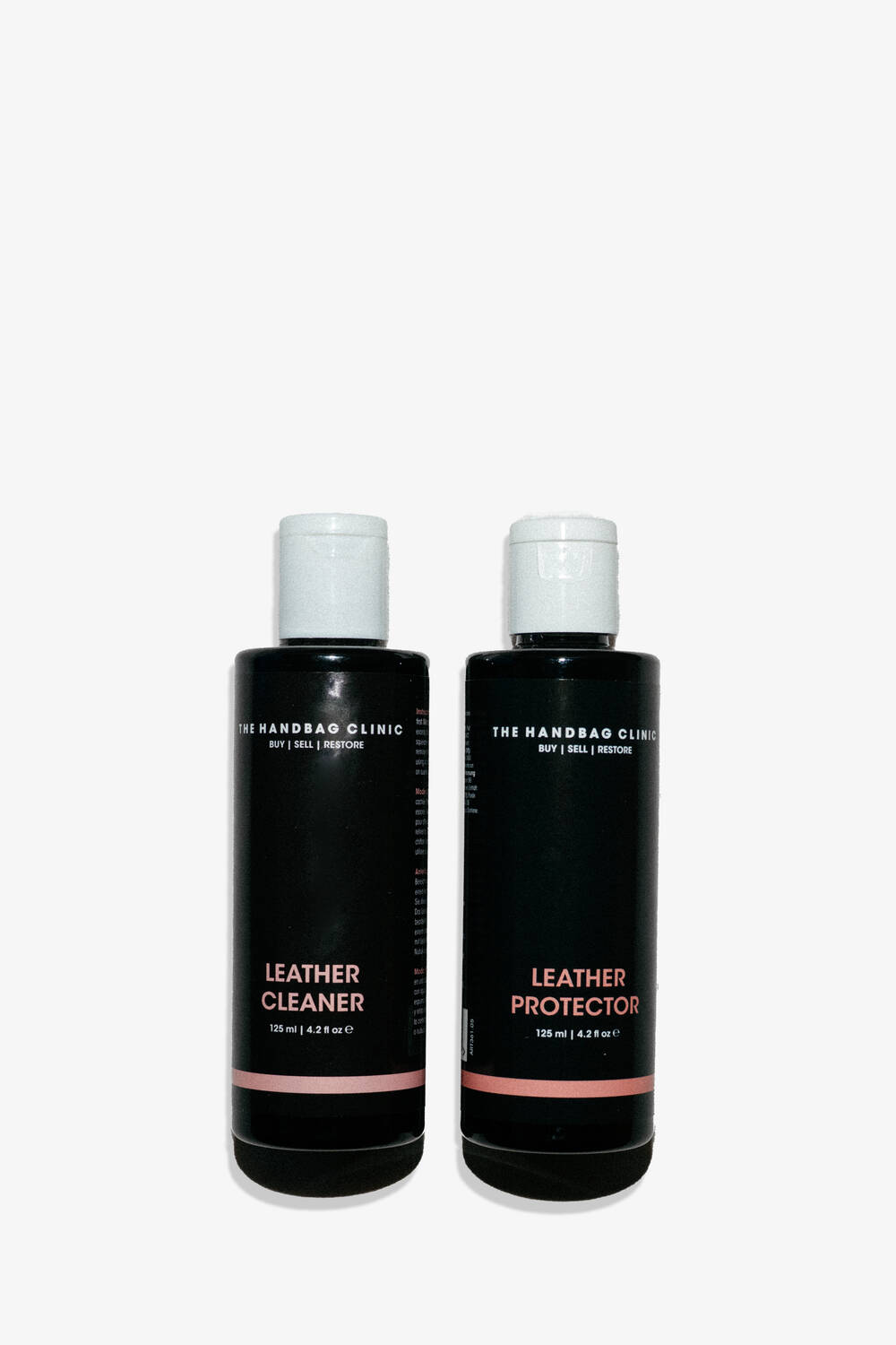 Two black bottles labeled "Leather Cleaner" and "Leather Protector" from The Handbag Clinic, perfect for caring for your INA KENT accessories, stand side by side on a white background.