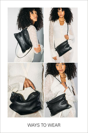 Woman modeling an INA KENT black leather handbag in various styles: crossbody, clutch, and shoulder. She is wearing a white textured dress. The text at the bottom reads "WAYS TO WEAR.