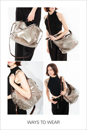 Four images show different ways to wear the silver-colored INA KENT bag named DELA EDEN. The bag is carried by hand, over the shoulder, and crossbody.