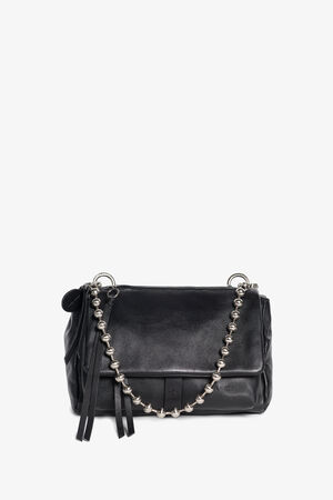 An INA KENT black leather handbag with a flap closure, silver chain strap featuring round beads, and black leather tassel accents, displayed against a white background.