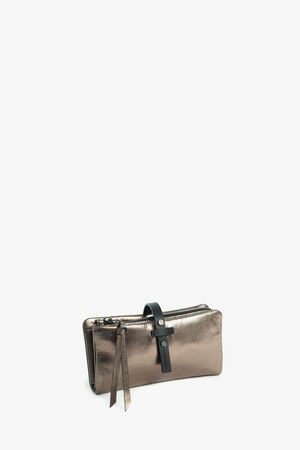 An INA KENT metallic bronze zippered clutch wallet with black leather strap and pull tabs, displayed upright against a plain white background.