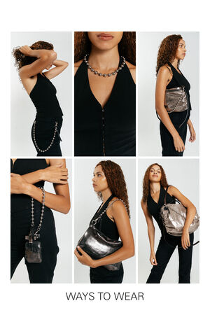 A woman demonstrates six different ways to wear an INA KENT metallic handbag with a chain strap, including crossbody, shoulder, and handheld styles. Text at the bottom reads “WAYS TO WEAR.”.