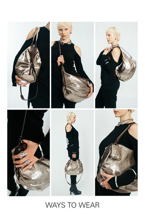 Six photos show a person demonstrating different ways to wear and carry an INA KENT metallic silver handbag with a shoulder strap. Text at the bottom reads “WAYS TO WEAR.”.