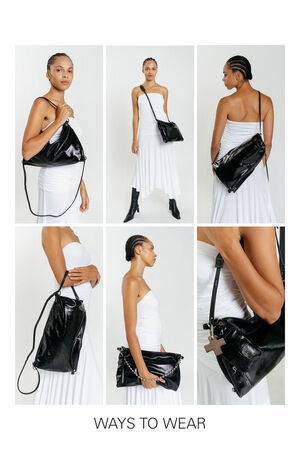 A woman in a white strapless dress demonstrates six stylish ways to wear or carry an INA KENT shiny black handbag with a shoulder strap. Text at the bottom reads "WAYS TO WEAR.