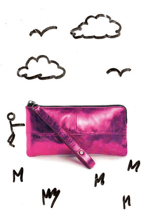 A shiny pink INA KENT wristlet purse is placed on a white background with black marker drawings of clouds, birds, a stick figure, and scattered letters.