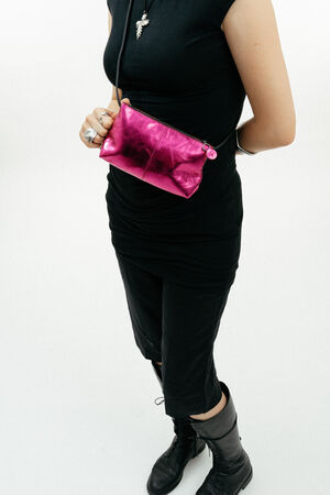 small metallic neon pink leather bag by INA KENT crossbody closeup