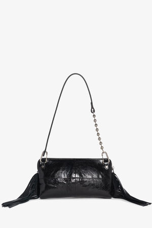 A black patent leather INA KENT handbag with a single shoulder strap, metal chain detail, and tassels on both sides, shown against a white background.