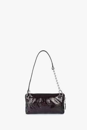 A small, shiny black leather INA KENT handbag with a single shoulder strap featuring a metal chain detail, displayed against a plain white background.