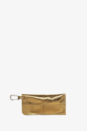 A metallic gold rectangular pouch by INA KENT with stitched details, a zipper closure, and a silver-colored carabiner clip attached on the left side, displayed on a white background.