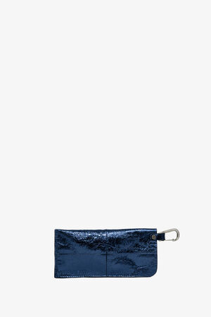 A shiny, dark blue rectangular INA KENT pouch with a front pocket and a silver carabiner clip attached to one corner, set against a plain white background.