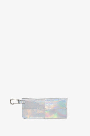 Rectangular iridescent pouch by INA KENT with stitched sections, silver zipper, and metal carabiner clip against a plain white background.
