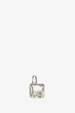 A small metallic silver INA KENT pouch with a flap closure and a carabiner clip attached to the top, set against a plain white background.