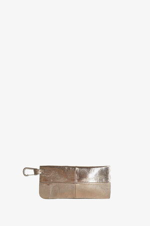 Metallic gold rectangular pouch by INA KENT with a zipper and a metal clip attached to one end, displayed on a plain white background.