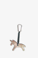 A metallic unicorn-shaped keychain by INA KENT with a black strap and a silver carabiner clip attached.