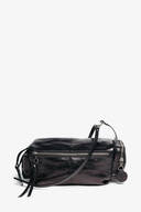 INA KENT black leather crossbody bag with a front zipper pocket, adjustable strap, and round metal keychain accessory, displayed against a plain white background.