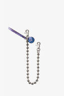 A metallic ball chain with two lobster clasps, a blue round INA KENT tag, and a purple textured strap against a white background.