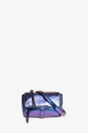 A small, metallic purple INA KENT crossbody bag with a flap closure and an adjustable strap, placed against a plain white background.